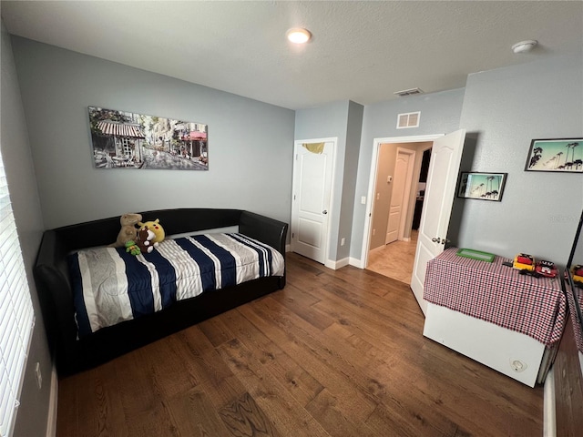 bedroom featuring wood-type flooring