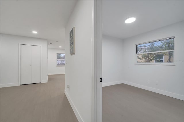 hall with light hardwood / wood-style floors