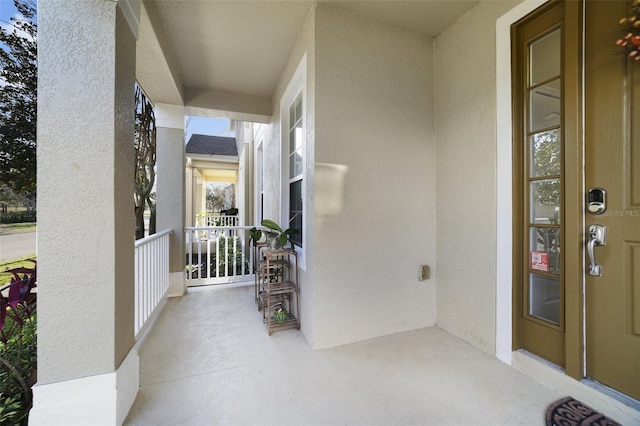 property entrance with stucco siding