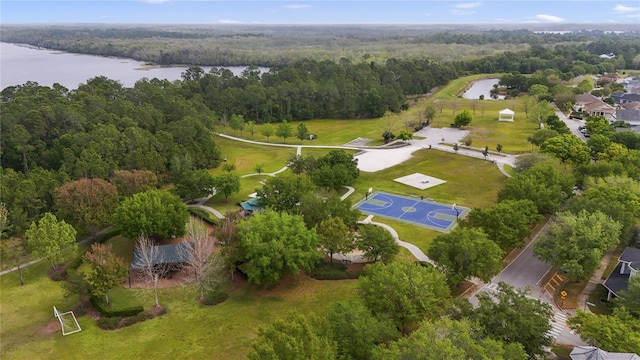 aerial view featuring a view of trees and a water view