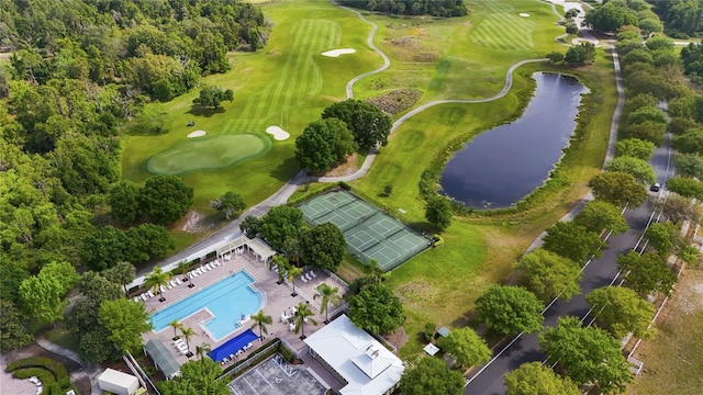 bird's eye view with view of golf course and a water view