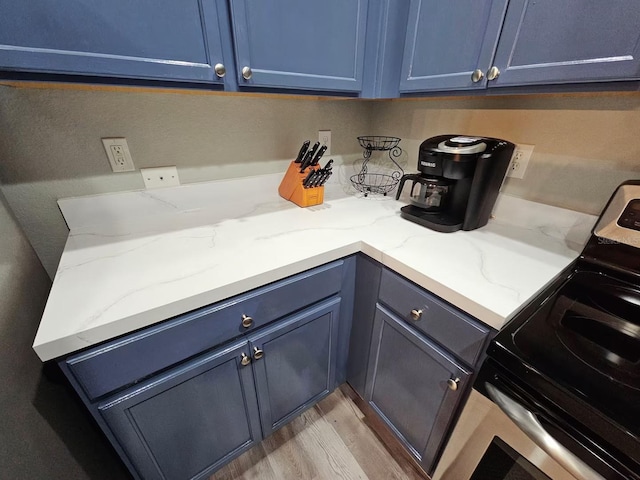 laundry room featuring light hardwood / wood-style flooring