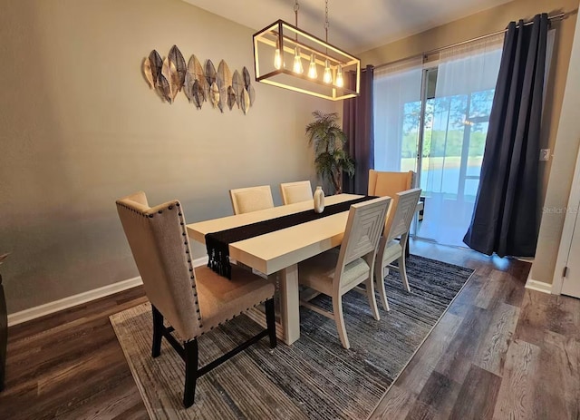 dining area featuring dark hardwood / wood-style flooring