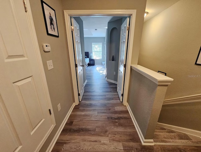 hall with dark wood-type flooring