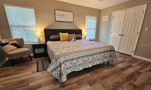 bedroom with a closet and hardwood / wood-style floors