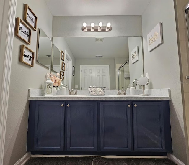 bathroom featuring vanity and walk in shower