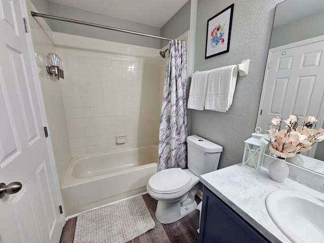 full bathroom featuring toilet, vanity, shower / tub combo with curtain, and hardwood / wood-style flooring