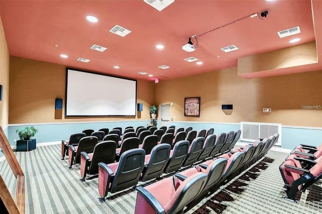 home theater room with light carpet