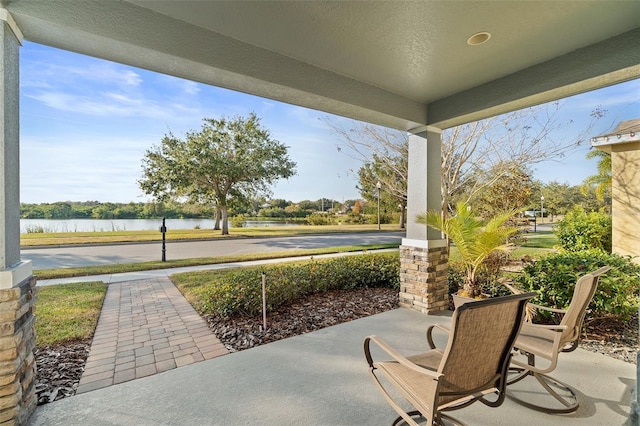 view of patio / terrace featuring a water view