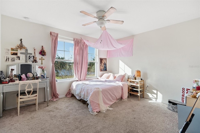 carpeted bedroom with ceiling fan