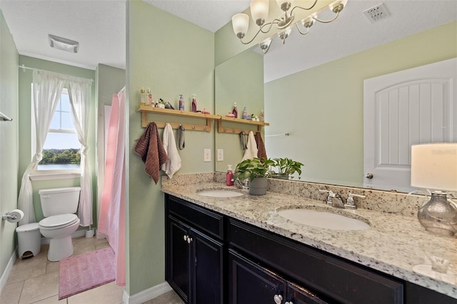 bathroom with toilet, a notable chandelier, tile patterned flooring, a textured ceiling, and vanity