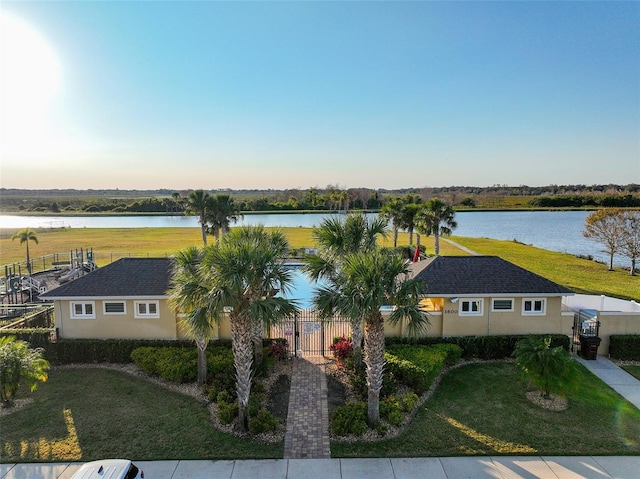 birds eye view of property with a water view