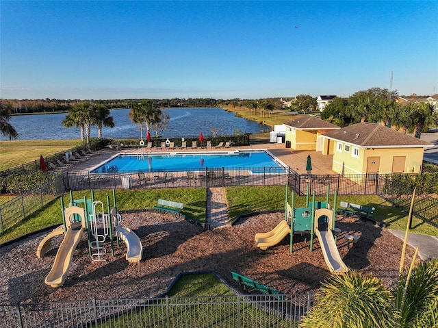 view of pool featuring a water view and a playground