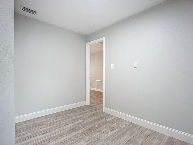 unfurnished room featuring light wood-type flooring