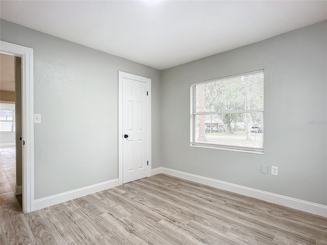 spare room featuring light wood-type flooring