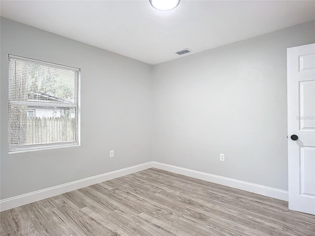 unfurnished room with light hardwood / wood-style flooring