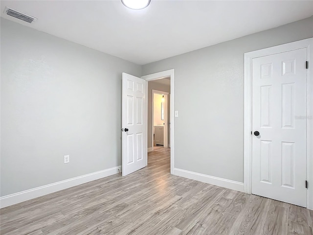 unfurnished bedroom with light hardwood / wood-style floors