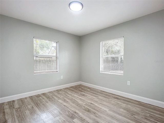 unfurnished room featuring light hardwood / wood-style flooring