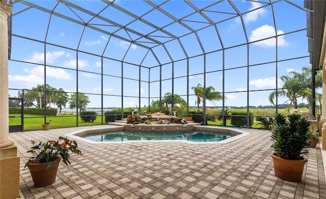 view of pool with a lanai and a patio area