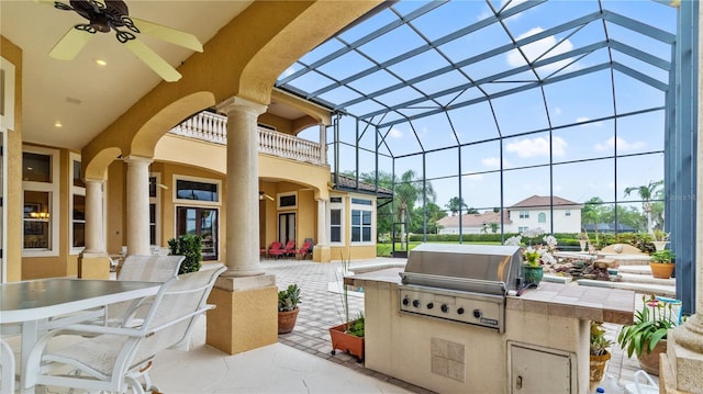 view of patio featuring a lanai, grilling area, a balcony, area for grilling, and ceiling fan