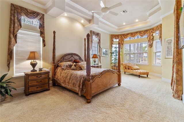 bedroom featuring ceiling fan, crown molding, a raised ceiling, and carpet floors