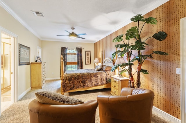 bedroom featuring ornamental molding, ceiling fan, light carpet, and ensuite bath