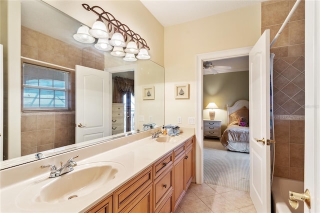 bathroom featuring ceiling fan, vanity, bathtub / shower combination, and tile patterned floors