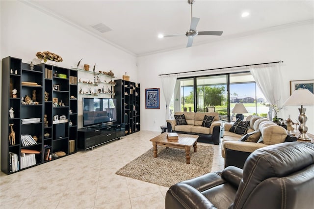 living room with tile patterned floors, ceiling fan, and crown molding