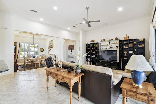 tiled living room with ceiling fan and ornamental molding