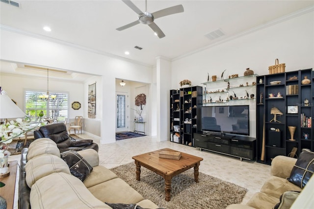 tiled living room with ceiling fan with notable chandelier and crown molding