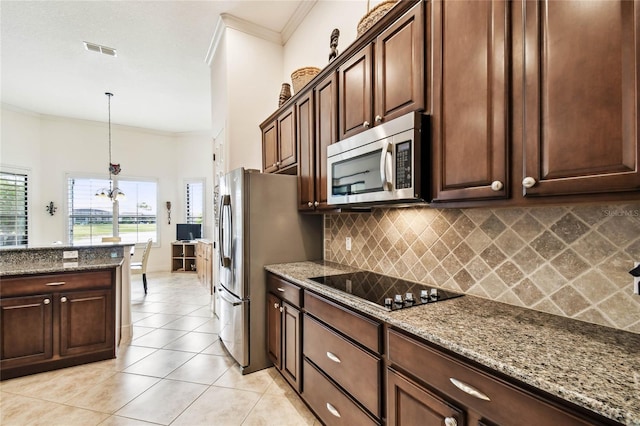 kitchen with light stone countertops, appliances with stainless steel finishes, backsplash, ornamental molding, and dark brown cabinets