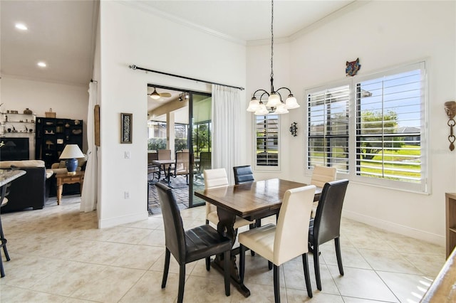 dining space with crown molding, light tile patterned flooring, and a notable chandelier