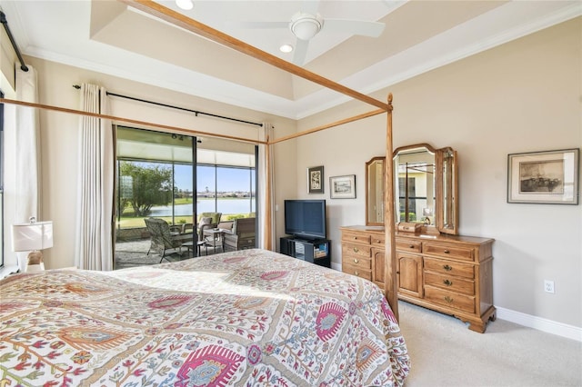 bedroom featuring ceiling fan, a raised ceiling, light colored carpet, access to outside, and ornamental molding