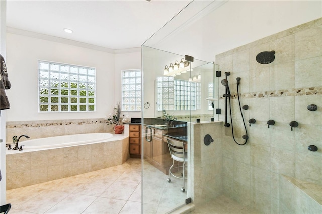 bathroom with tile patterned flooring, vanity, separate shower and tub, and crown molding