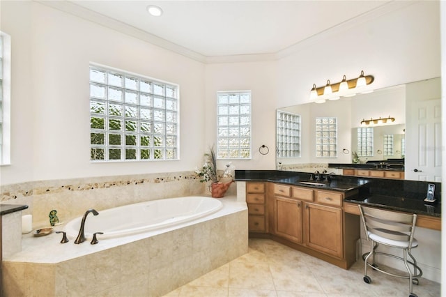 bathroom featuring tile patterned flooring, vanity, ornamental molding, and tiled tub