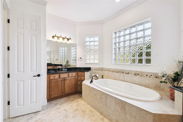 bathroom featuring tiled bath, tile patterned flooring, vanity, and ornamental molding