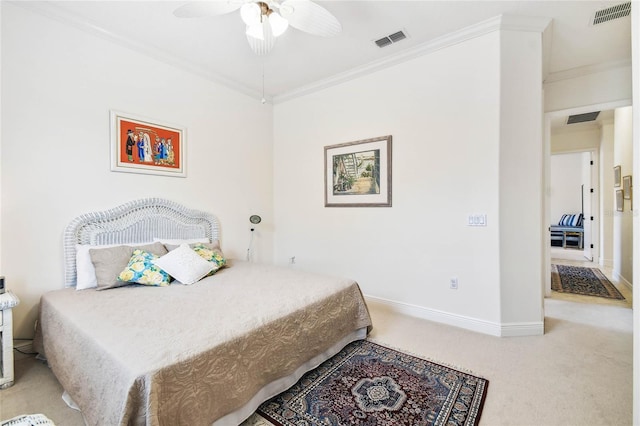 carpeted bedroom with ceiling fan and crown molding