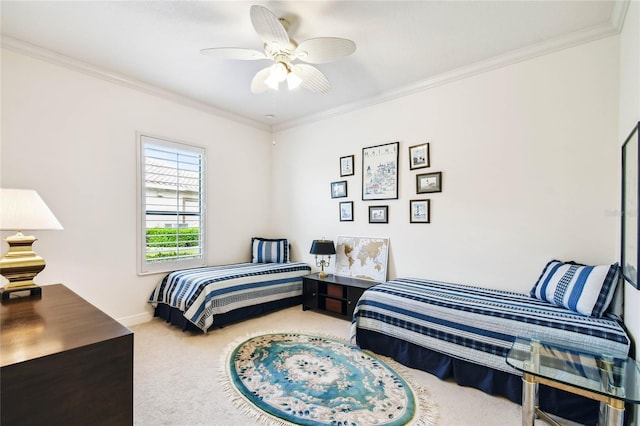 carpeted bedroom featuring ceiling fan and crown molding