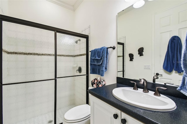 bathroom featuring vanity, toilet, crown molding, and walk in shower