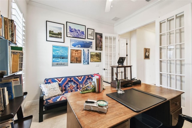 carpeted office space featuring ceiling fan, french doors, and ornamental molding