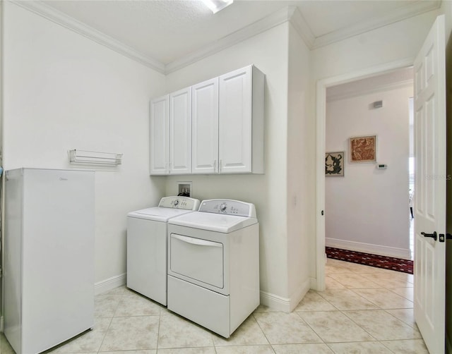 laundry area featuring independent washer and dryer, light tile patterned floors, and crown molding