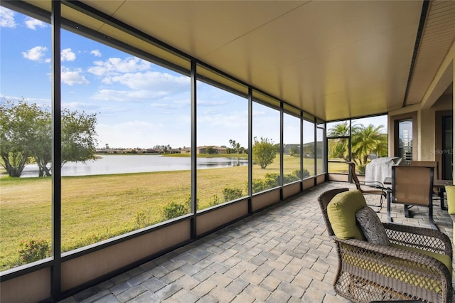 sunroom with a water view