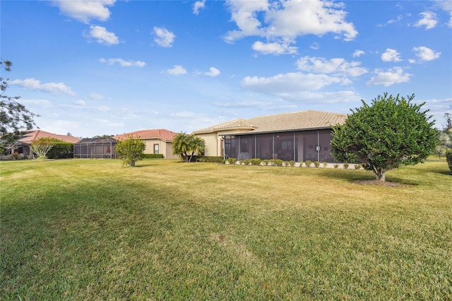 view of yard with a sunroom