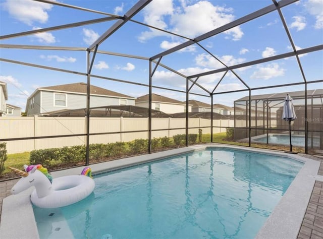 view of pool featuring a lanai and a patio