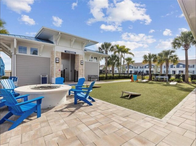 view of patio / terrace with an outdoor fire pit