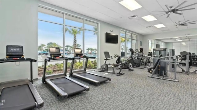 exercise room with ceiling fan