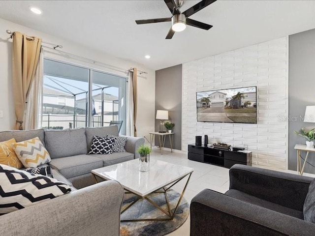 living room featuring light tile patterned floors and ceiling fan