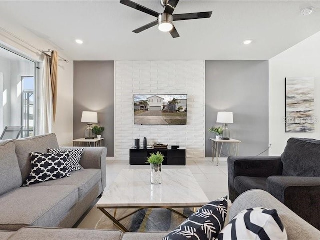 living room with light tile patterned flooring and ceiling fan