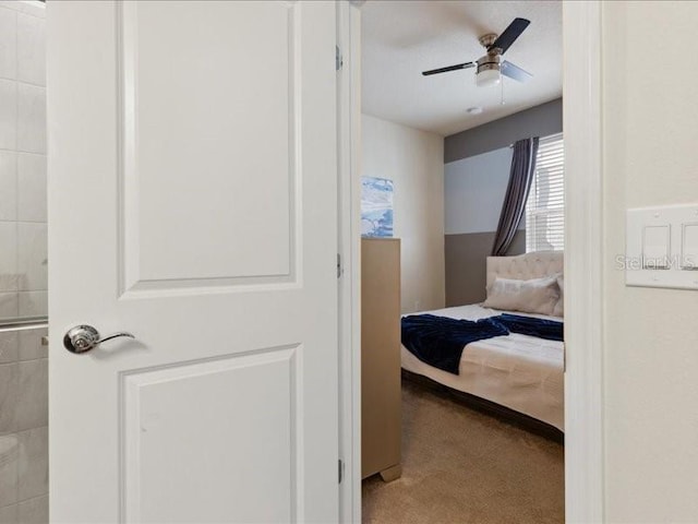 bedroom with ceiling fan and light carpet