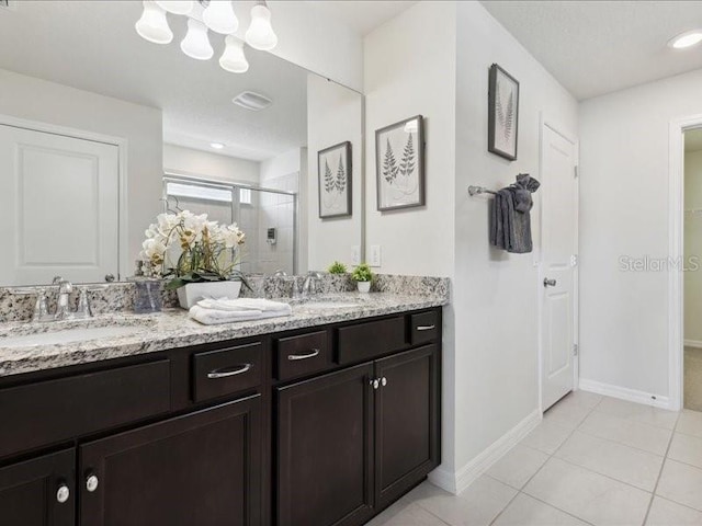 bathroom with vanity, tile patterned floors, and walk in shower